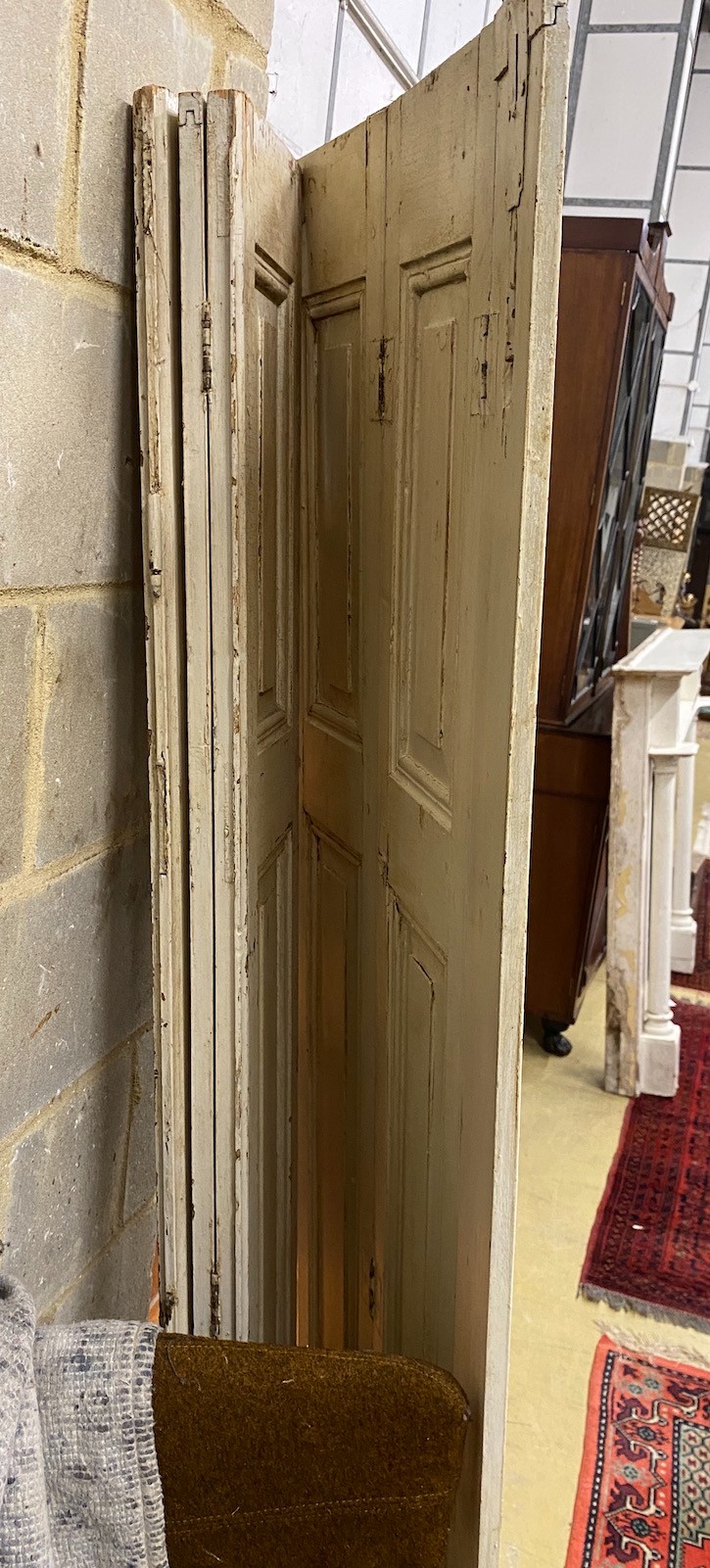 A pair of 19th century painted bifold shutters, height 198cm